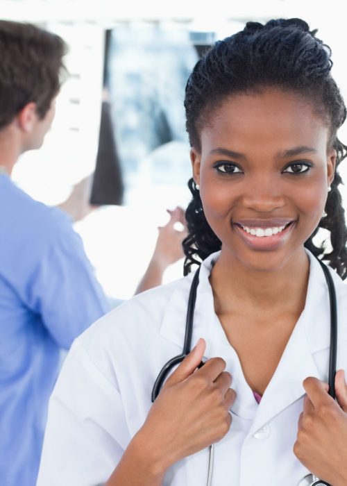 portrait-doctor-looking-x-ray-while-his-colleague-is-smiling.jpg